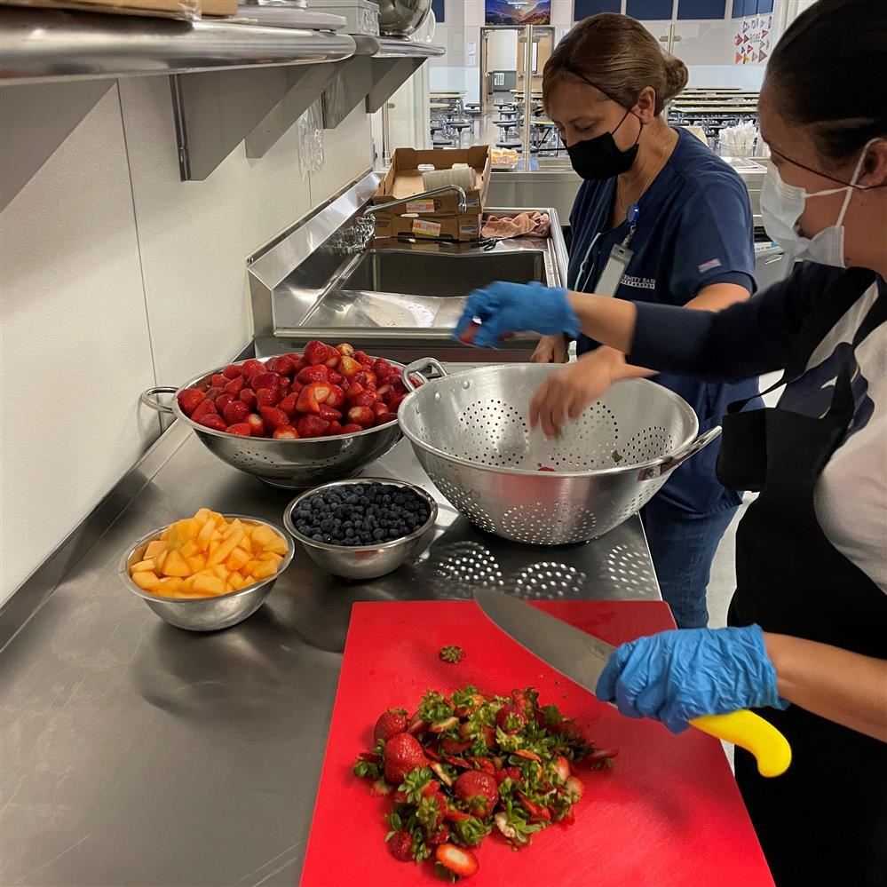  Cafeteria workers preparing meals