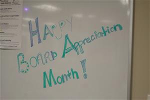 Sign on white board: Happy Board Appreciation Month